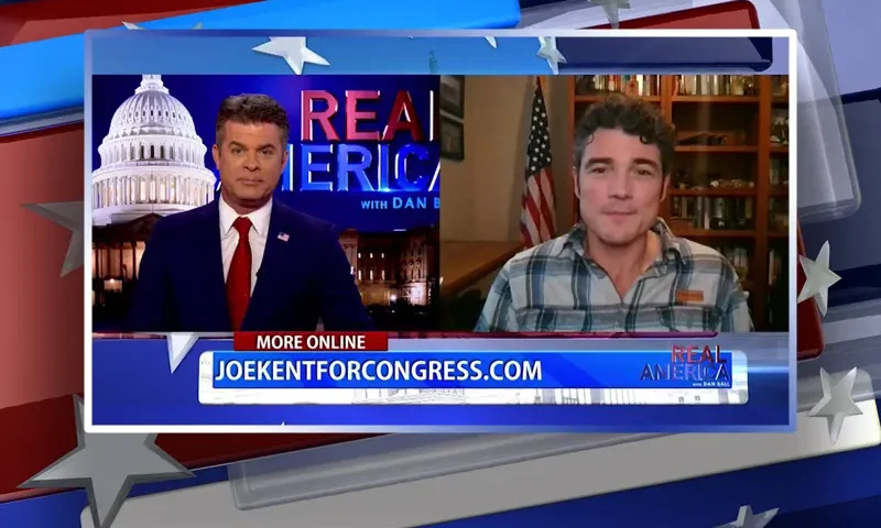 Video still from Real America on One America News Network showing a split screen of the host on the left side, and on the right side is the guest, Joe Kent.