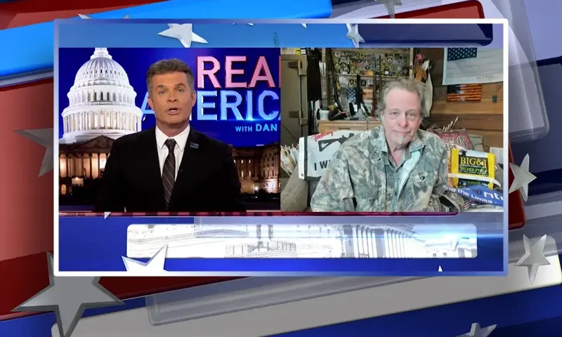 Video still from Real America on One America News Network showing a split screen of the host on the left side, and on the right side is the guest, Ted Nugent.