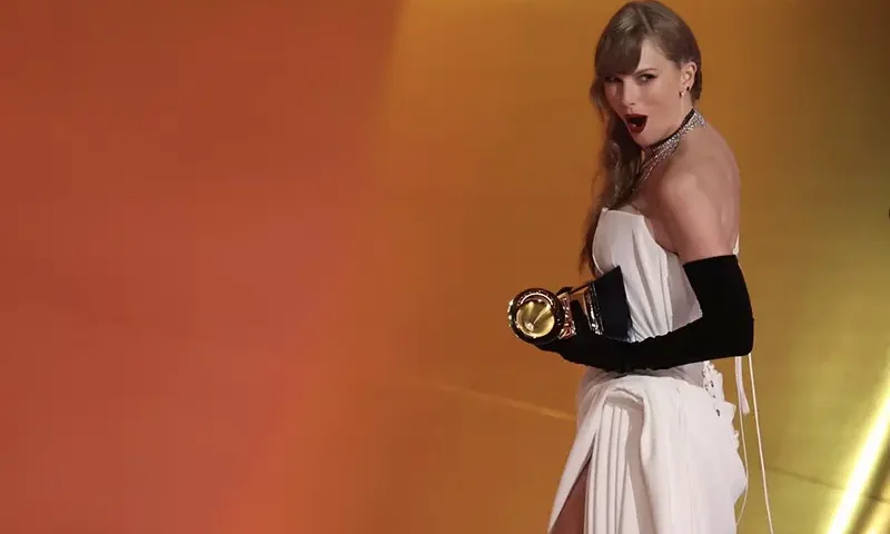 Taylor Swift accepts the award for Best Pop Vocal Album for Midnights during the 66th Annual Grammy Awards in Los Angeles. REUTERS/Mike Blake