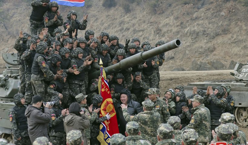 In this photo provided by the North Korean government, North Korean leader Kim Jong Un, center, meets soldiers who took part in a training in North Korea Wednesday, March 13, 2024. Independent journalists were not given access to cover the event depicted in this image distributed by the North Korean government. The content of this image is as provided and cannot be independently verified. Korean language watermark on image as provided by source reads: "KCNA" which is the abbreviation for Korean Central News Agency. (Korean Central News Agency/Korea News Service via AP)