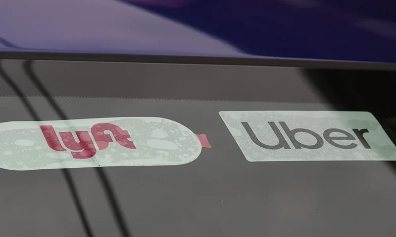 Rideshare drivers demonstrate against rideshare companies Uber and Lyft during a car caravan protest on August 6, 2020 in Los Angeles. - The drivers, organized by the Mobile Workers Alliance and Rideshare Drivers United unions, say Uber and Lyft's are pushing a "deceptive" November ballot initiative, which, if passed, they claim would "rewrite labor law" and turn app-based drivers into independent contractors, exempting companies such as Lyft and Uber from standard wage and hour restrictions. (Photo by Robyn Beck / AFP) (Photo by ROBYN BECK/AFP via Getty Images)