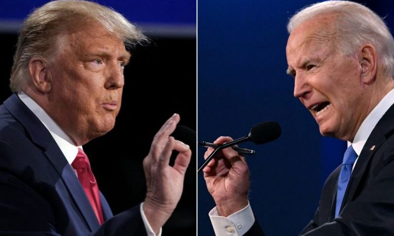 TOPSHOT - (COMBO) This combination of pictures created on October 22, 2020 shows US President Donald Trump (L) and Democratic Presidential candidate and former US Vice President Joe Biden during the final presidential debate at Belmont University in Nashville, Tennessee, on October 22, 2020. (Photo by Brendan Smialowski and JIM WATSON / AFP) (Photo by BRENDAN SMIALOWSKIJIM WATSON/AFP via Getty Images)