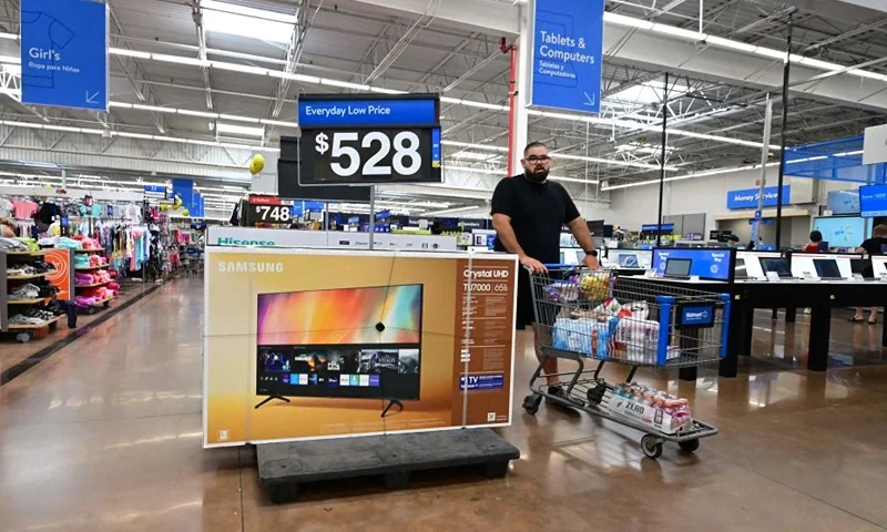 A man pushes his cart through a store in Rosemead, California on June 28, 2022. - Americans' feelings about the economy slumped further in June after falling sharply the month before amid concerns over skyrocketing inflation, according to a survey released on June 28. Amid the fastest increase in US consumer prices in more than four decades, made worse by the war in Ukraine, the consumer confidence index fell to 98.7 from 103.2, its lowest level since February 2021, according to The Conference Board's monthly survey. (Photo by Frederic J. BROWN / AFP) (Photo by FREDERIC J. BROWN/AFP via Getty Images)