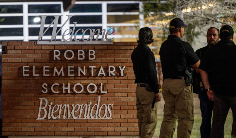 UVALDE, TEXAS - MAY 24: Law enforcement officers speak together outside of Robb Elementary School following the mass shooting at Robb Elementary School on May 24, 2022 in Uvalde, Texas. According to reports, 19 students and 2 adults were killed, with the gunman fatally shot by law enforcement. (Photo by Brandon Bell/Getty Images)