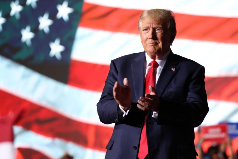 MINDEN, NEVADA - OCTOBER 08: Former U.S. President Donald Trump greets supporters during a campaign rally at Minden-Tahoe Airport on October 08, 2022 in Minden, Nevada. Former U.S. President Donald Trump held a campaign style rally for Nevada GOP candidates ahead of the state's midterm election on November 8th. (Photo by Justin Sullivan/Getty Images)