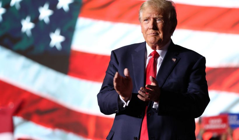 MINDEN, NEVADA - OCTOBER 08: Former U.S. President Donald Trump greets supporters during a campaign rally at Minden-Tahoe Airport on October 08, 2022 in Minden, Nevada. Former U.S. President Donald Trump held a campaign style rally for Nevada GOP candidates ahead of the state's midterm election on November 8th. (Photo by Justin Sullivan/Getty Images)