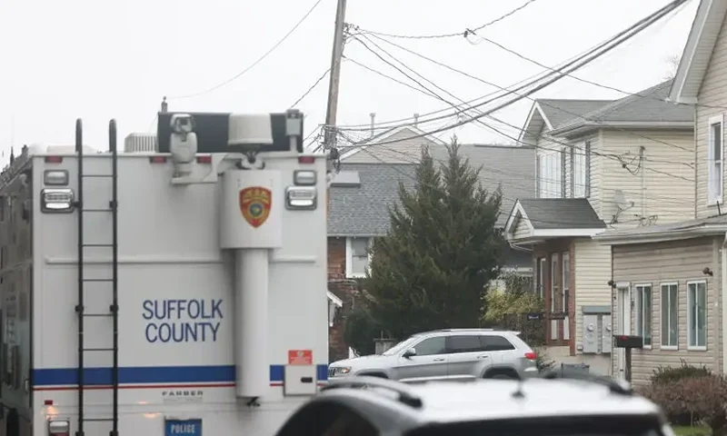 Suffolk County Police Crime Scene investigators outside of a home on Railroad Avenue in Amityville, New York on March 5, 2024, in connection to body parts that had been discovered at Southards Pond Park in Babylon, Bethpage State Park, and West Babylon. (Photo by James Carbone/Newsday RM via Getty Images)