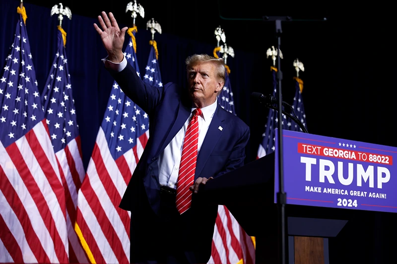 Donald Trump Holds Campaign Rally In Rome, GA
ROME, GEORGIA - MARCH 09: Republican presidential candidate and former U.S. President Donald Trump leaves the stage a the conclusion of a campaign rally at the Forum River Center March 09, 2024 in Rome, Georgia. Both Trump and President Joe Biden are holding campaign events on Saturday in Georgia, a critical battleground state, two days before the its primary elections. A city of about 38,000, Rome is in the heart of conservative northwest Georgia and the center of the Congressional district represented by Rep. Majorie Taylor Green (R-GA). (Photo by Chip Somodevilla/Getty Images)