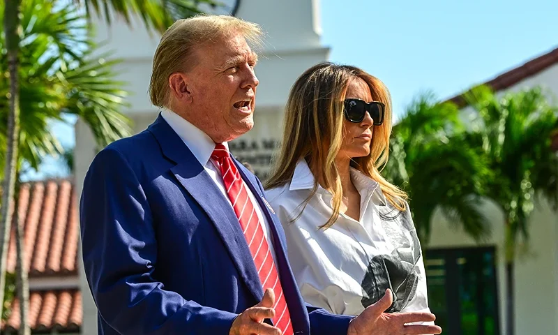 Former US President and Republican presidential candidate Donald Trump (L) and former First Lady Melania Trump arrive to vote in Florida's primary election at a polling station at the Morton and Barbara Mandel Recreation Center in Palm Beach, Florida, on March 19, 2024. (Photo by GIORGIO VIERA / AFP) (Photo by GIORGIO VIERA/AFP via Getty Images)