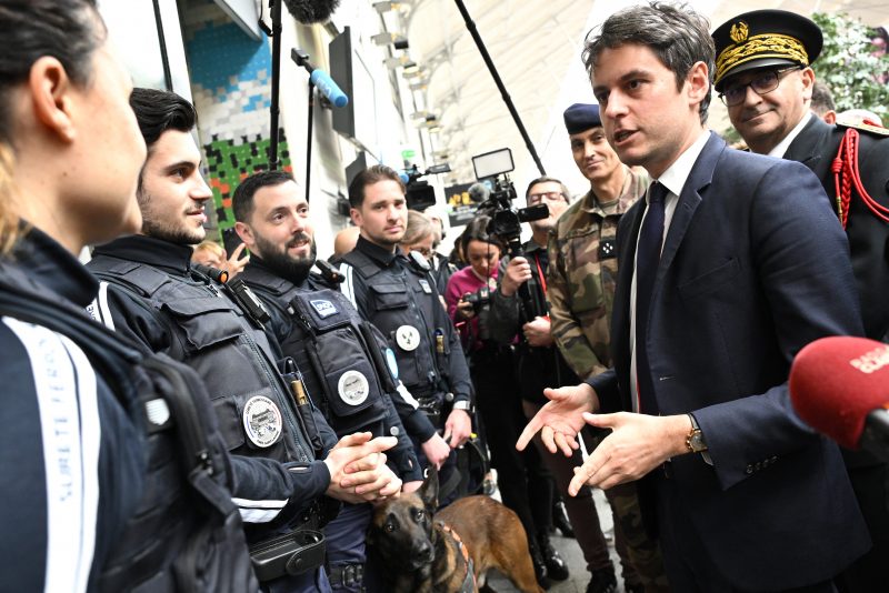 French Prime Minister Gabriel Attal (2nd R) speaks with French SNCF railway's security staff during a visit to the Saint-Lazare railway station in Paris on March 25, 2024. Four months ahead of the Paris 2024 Olympic Games, French authorities has raised the maximum alert level for terrorist threat, after the Moscow attack carried out, according to the French President, by an "entity" of the "Islamic State" group behind "several recent attempts" on French territory. (Photo by Bertrand GUAY / AFP) (Photo by BERTRAND GUAY/AFP via Getty Images)