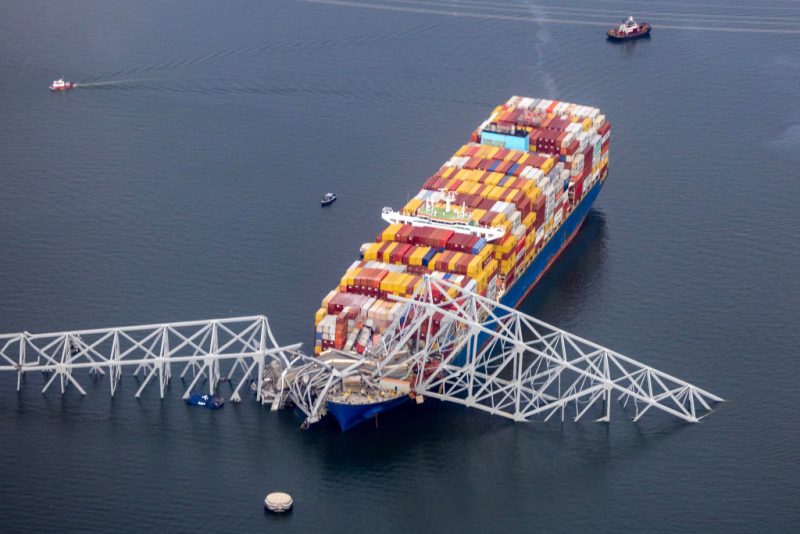 BALTIMORE, MARYLAND - MARCH 26: In an aerial view, cargo ship Dali is seen after running into and collapsing the Francis Scott Key Bridge on March 26, 2024 in Baltimore, Maryland. Rescuers are searching for at least seven people, authorities say, while two others have been pulled from the Patapsco River. (Photo by Tasos Katopodis/Getty Images)