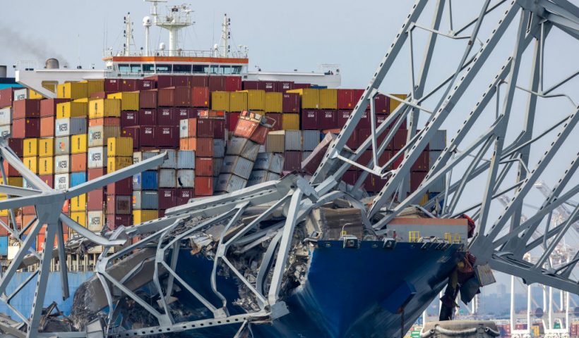 BALTIMORE, MARYLAND - MARCH 26: The cargo ship Dali sits in the water after running into and collapsing the Francis Scott Key Bridge on March 26, 2024 in Baltimore, Maryland. According to reports, rescuers are still searching for multiple people, while two survivors have been pulled from the Patapsco River. A work crew was fixing potholes on the bridge, which is used by roughly 30,000 people each day, when the ship struck at around 1:30am on Tuesday morning. The accident has temporarily closed the Port of Baltimore, one of the largest and busiest on the East Coast of the U.S. (Photo by Tasos Katopodis/Getty Images)