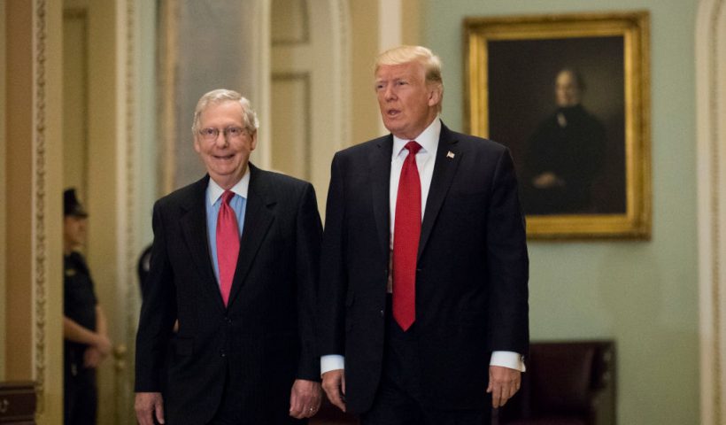WASHINGTON, DC - OCTOBER 24: U.S. President Donald Trump (R) and Senate Majority Leader Mitch McConnell (R-KY) walk to a lunch with Senate Republicans on Capitol Hill, October 24, 2017 in Washington, DC. Trump joined the senators to talk about upcoming legislation, including the proposed GOP tax cuts and reform. (Photo by Drew Angerer/Getty Images)