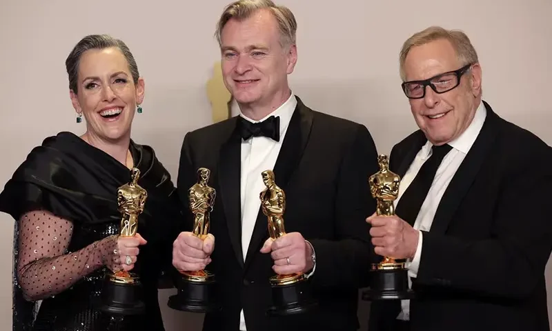 Christopher Nolan, Emma Thomas and Charles Roven pose with the Oscar for Best Picture for "Oppenheimer" in the Oscars photo room at the 96th Academy Awards in Hollywood, Los Angeles, California, U.S., March 10, 2024. REUTERS/Carlos Barria