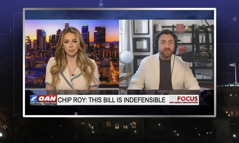 Video still from In Focus on One America News Network showing a split screen of the host on the left side, and on the right side is the guest, Josh Hammer.