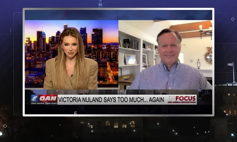 Video still from In Focus on One America News Network showing a split screen of the host on the left side, and on the right side is the guest, Dr. Dave Brat.