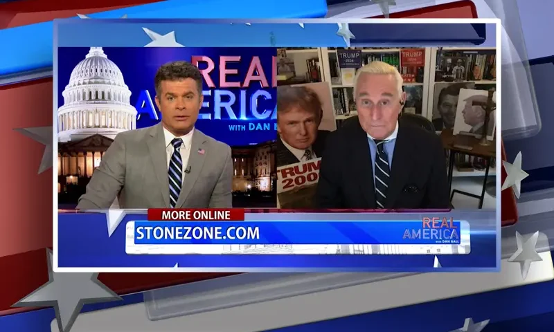 Video still from Real America on One America News Network showing a split screen of the host on the left side, and on the right side is the guest, Roger Stone.