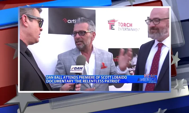Video still from Real America on One America News Network during an interview with the guest, Scott LoBaido.