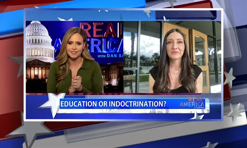 Video still from Real America on One America News Network showing a split screen of the host on the left side, and on the right side is the guest, Sonja Shaw.