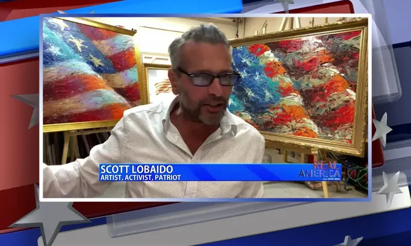 Video still from Real America on One America News Network during an interview with the guest, Scott LoBaido.