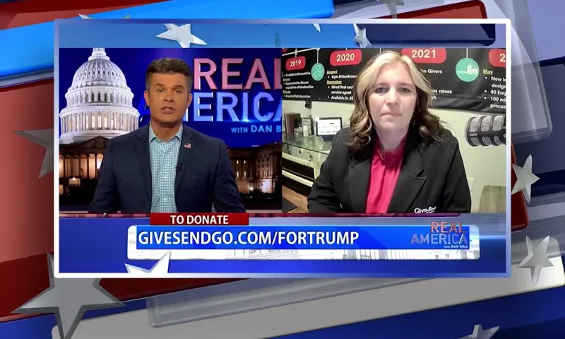 Video still from Real America on One America News Network showing a split screen of the host on the left side, and on the right side is the guest, Heather Wilson.