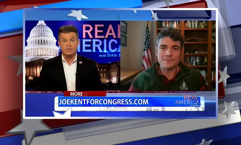 Video still from Real America on One America News Network showing a split screen of the host on the left side, and on the right side is the guest, Joe Kent.