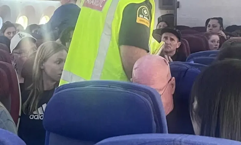 A paramedic walks onboard as passengers look on, after an incident on a LATAM Airlines Boeing 787, in Auckland, New Zealand, March 11, 2024, in this picture obtained from social media. Brian Adam Jokat/via REUTERS