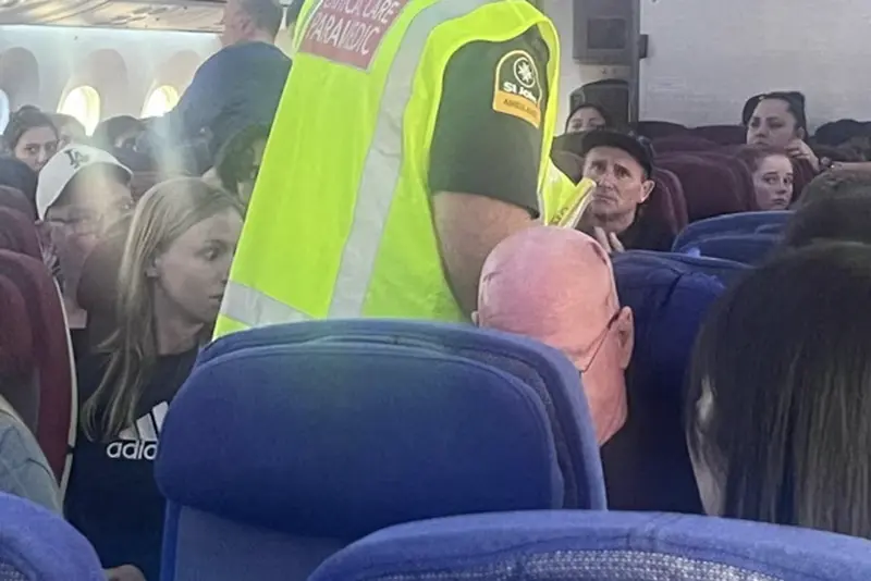 A paramedic walks onboard as passengers look on, after an incident on a LATAM Airlines Boeing 787, in Auckland, New Zealand, March 11, 2024, in this picture obtained from social media. Brian Adam Jokat/via REUTERS