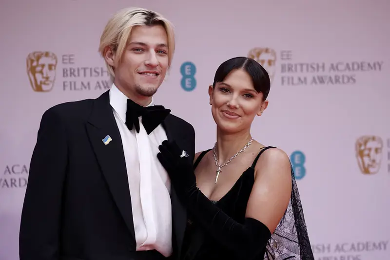 Millie Bobby Brown and Jake Bongiovi arrive at the 75th British Academy of Film and Television Awards (BAFTA) at the Royal Albert Hall in London, Britain, March 13, 2022. REUTERS/Henry Nicholls/File Photo