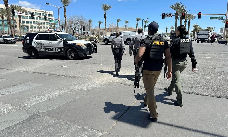 Law enforcement responds to a shooting Monday, April 8, 2024 at a law office in Las Vegas. (AP Photo/Ty ONeil)