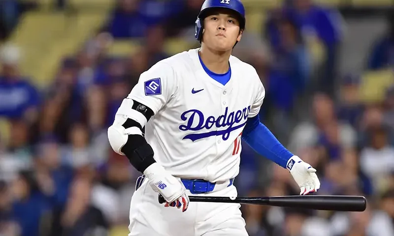 Los Angeles Dodgers designated hitter Shohei Ohtani (17) reacts after striking out against the San Francisco Giants during the first inning at Dodger Stadium. Mandatory Credit: Gary A. Vasquez-USA TODAY Sports
