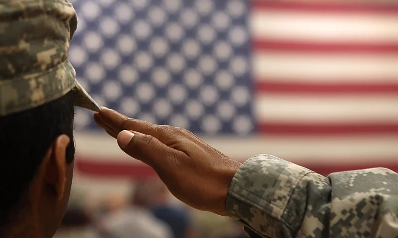 FORT CARSON, CO - JUNE 15: A soldier salutes the flag during a welcome home ceremony for troops arriving from Afghanistan on June 15, 2011 to Fort Carson, Colorado. More than 500 soldiers from the 1st Brigade Combat Team returned home following a year of heavy fighting and high casualties in Afghanistan's southern Kandahar province. (Photo by John Moore/Getty Images)