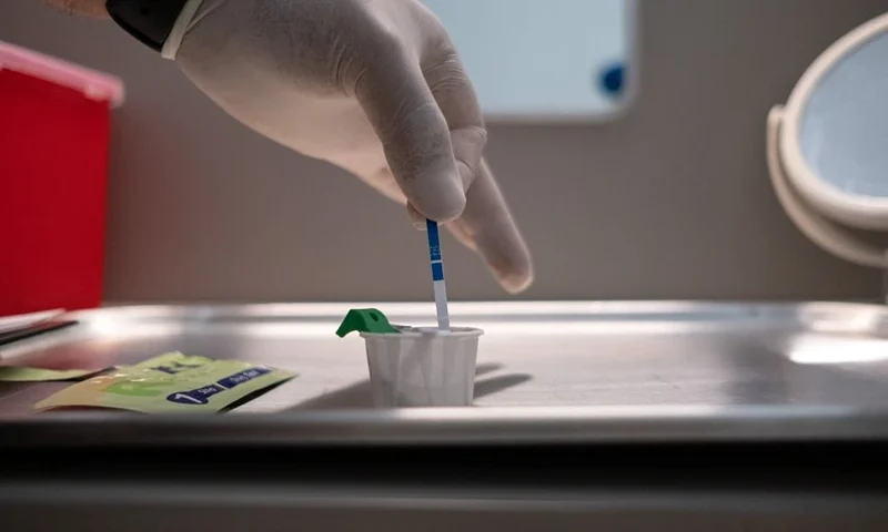 The director of Verter Community Center, Said Slim, tests a sample looking for fentanyl positive over a heroin dosis, at La Sala, a safe space for women using drugs at Verter in Mexicali, Baja California State, Mexico, on May 9, 2023. Following the discovery that heroin is being cut with fentanyl, an opioid that lurks as a global threat, ONG Verter created La Sala, a safe place for vulnerable heroin users in Mexicali -in the Mexico-US border- to consume and avoid overdose. (Photo by Guillermo ARIAS / AFP) (Photo by GUILLERMO ARIAS/AFP via Getty Images)