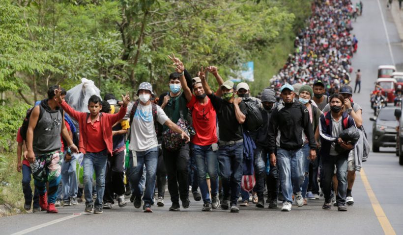 EL FLORIDO, GUATEMALA - JANUARY 16: Migrants enter Guatemala after breaking a police barricade at the border checkpoint on January 16, 2021 in El Florido, Guatemala. The caravan departed from Honduras to walk across Guatemala and Mexico to eventually reach the United States. Central Americans expect to receive asylum and most Hondurans decided to migrate after being hit by recent hurricanes Eta and Iota. Honduras recently asked to U.S. to extend their Temporary Protected Status. (Photo by Josue Decavele/Getty Images)