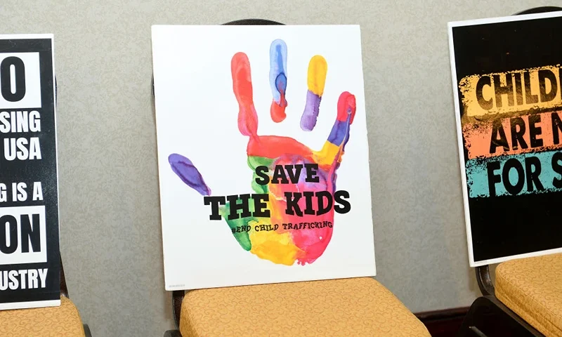 NEW YORK, NEW YORK - FEBRUARY 14: Signs on display as Cosmopolitan NYFW brings awareness against child sex trafficking at New Yorker Hotel on February 14, 2021 in New York City. (Photo by Noam Galai/Getty Images for Cosmopolitan NYFW)