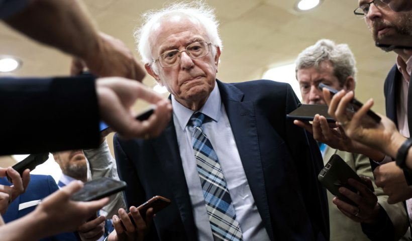 WASHINGTON, DC - JULY 21: U.S. Sen. Bernie Sanders (I-VT) talks to reporters as he walks to a vote at the U.S. Capitol on July 21, 2021 in Washington, DC. The Senate is expected to hold a cloture vote on the bipartisan infrastructure bill later today. (Photo by Kevin Dietsch/Getty Images)