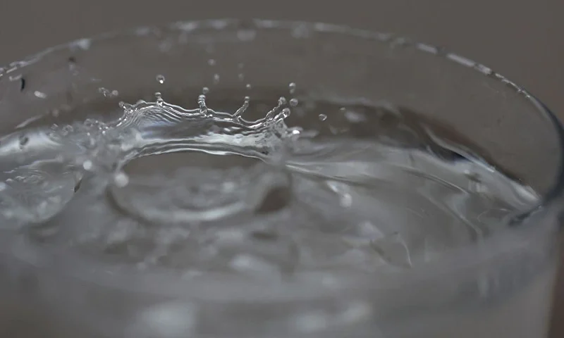 SAN ANSELMO, CALIFORNIA - JULY 06: In this photo illustration, tap water drops into a glass on July 06, 2023 in San Anselmo, California. According to a study by the US Geological Survey, nearly half of the tap water in the United States is contaminated with "forever chemicals" that are considered dangerous to human health. Per and polyfluorinated alkyl substances, or PFAS, are chemicals that linger in the body and are linked to health issues like cancer, obesity, liver damage, decreased fertility, thyroid disease, high cholesterol and hormone suppression. (Photo Illustration by Justin Sullivan/Getty Images)