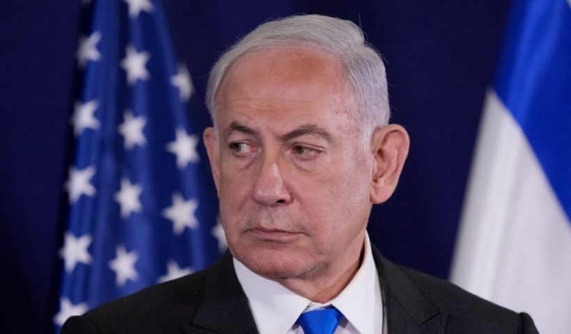 Israeli Prime Minister Benjamin Netanyahu looks on as the US Secretary of State gives statements to the media inside The Kirya, which houses the Israeli Defence Ministry, after their meeting in Tel Aviv on October 12, 2023. Blinken arrived in a show of solidarity after Hamas's surprise weekend onslaught in Israel, an AFP correspondent travelling with him reported. He is expected to visit Israeli Prime Minister Benjamin Netanyahu as Washington closes ranks with its ally that has launched a withering air campaign against Hamas militants in the Gaza Strip. (Photo by Jacquelyn Martin / POOL / AFP) (Photo by JACQUELYN MARTIN/POOL/AFP via Getty Images)
