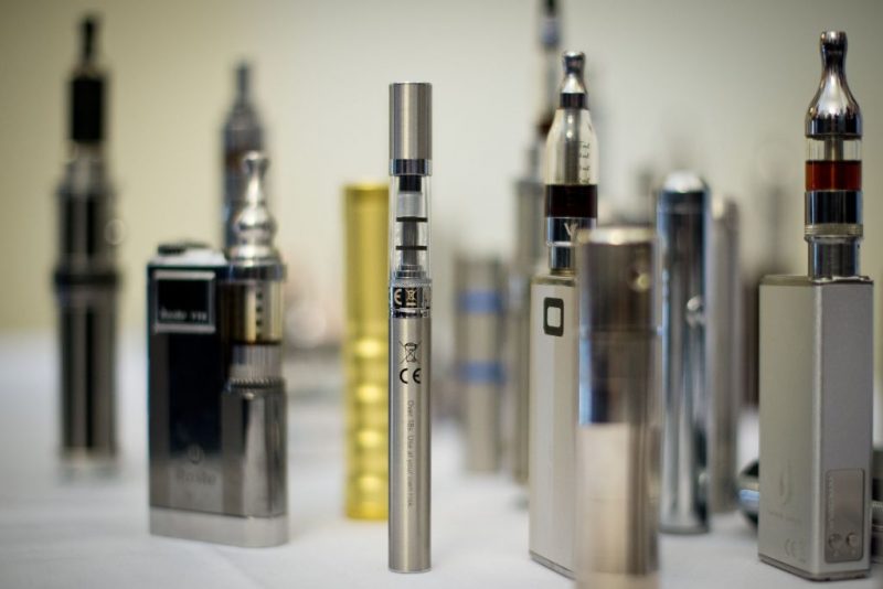 A selection of "Nicotine Containing Products", or "NCP"s are displayed during "The E-Cigarette Summit" at the Royal Academy in central London on November 12, 2013. The merits of e-cigarettes were thrashed out at a one-day gathering of scientists, experts, policymakers and industry figures at the Royal Society in London. The use of electronic cigarettes -- pen-sized battery-powered devices that simulate smoking by heating and vaporising a liquid solution containing nicotine -- has grown rapidly. AFP PHOTO / LEON NEAL / AFP PHOTO / LEON NEAL (Photo credit should read LEON NEAL/AFP via Getty Images)