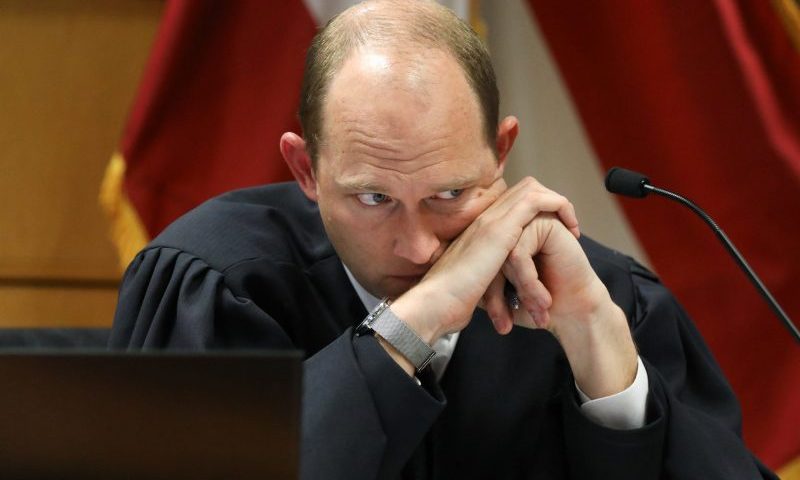 TOPSHOT-US-JUSTICE-POLITICS-TRUMP-GOERGIA TOPSHOT - Fulton County Superior Judge Scott McAfee listens during a hearing into 'misconduct' allegations against Georgia prosecutor Fanni Willis at the Fulton County Courthouse in Atlanta, Georgia, on February 15, 2024. Willis, who brought election interference charges against former US President Donald Trump, acknowledged on February 2, 2024, that she had a romantic relationship with special prosecutor Nathan Wade, whom she hired to work on the high-profile case. (Photo by ALYSSA POINTER / POOL / AFP) (Photo by ALYSSA POINTER/POOL/AFP via Getty Images)