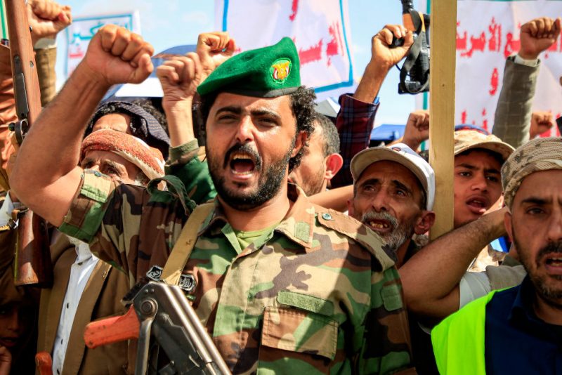 A member of security forces loyal to Yemen's Huthi group chants slogans with others during a pro-Palestinian and anti-Israel rally outside al-Saleh mosque in the Huthi-held capital Sanaa on March 29, 2024 amid the ongoing conflict in the Gaza Strip between Israel and the Palestinian militant group Hamas. (Photo by MOHAMMED HUWAIS / AFP) (Photo by MOHAMMED HUWAIS/AFP via Getty Images)