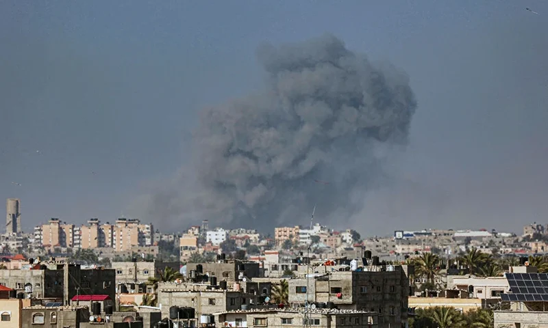 A picture taken from Rafah shows kites flown in the sky above the city as smoke billows during Israeli bombardment on Khan Yunis in the southern Gaza Strip on April 3, 2024, amid ongoing battles between Israel and the Palestinian militant group Hamas. (Photo by SAID KHATIB / AFP) (Photo by SAID KHATIB/AFP via Getty Images)