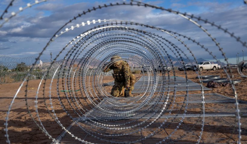 EL PASO, TEXAS - APRIL 02: A Texas National Guard soldier installs border fencing layered with concertina wire near the Rio Grande river on April 02, 2024 in El Paso, Texas. Last week, hundreds of migrants seeking asylum clashed with Texas national guardsmen while waiting to turn themselves in to border patrol agents for processing. Texas continues awaiting a verdict on Senate Bill 4. Attorneys representing the state of Texas are scheduled to return to the Fifth Circuit Court of Appeals in New Orleans on April 3 to continue arguing for the constitutional basis of the bill. Senate Bill 4 allows state law enforcement officials to detain and arrest undocumented immigrants suspected of illegally crossing into the United States. Thus far, all prior attempts to put the Bill into effect have been blocked by the Fifth Circuit Court of Appeals. (Photo by Brandon Bell/Getty Images)