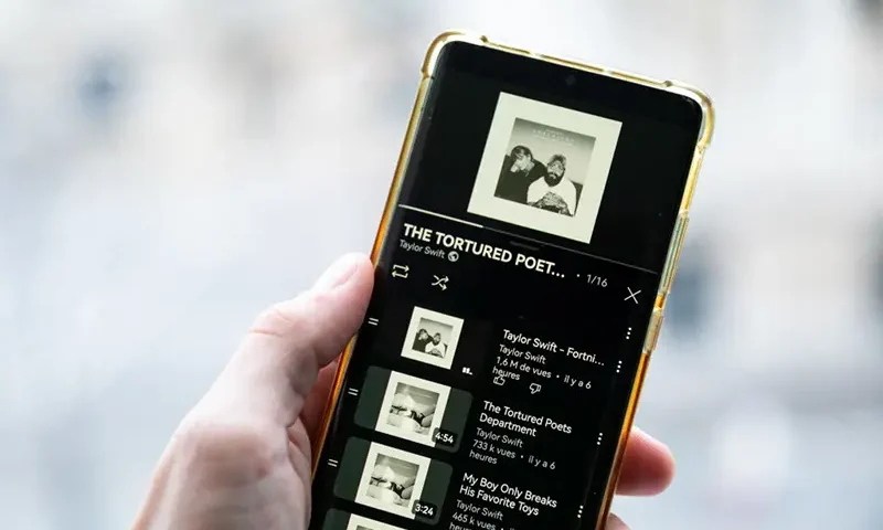 This photograph taken in Paris on April 19, 2024, shows a smatphone displaying the US singer-songwriter Taylor Swift's new album "The Tortured Poets Department" on Spotify. (Photo by AFP) (Photo by -/AFP via Getty Images)