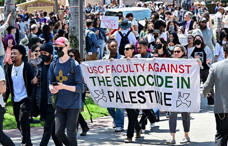 Faculty join pro-Palestinian students as they protest the Israel-Hamas war on the campus of the University of Southern California in Los Angeles, on April 24, 2024. Universities have become the focus of intense cultural debate in the United States since the October 7 Hamas attack and Israel's overwhelming military response to it. (Photo by Frederic J. BROWN / AFP) (Photo by FREDERIC J. BROWN/AFP via Getty Images)