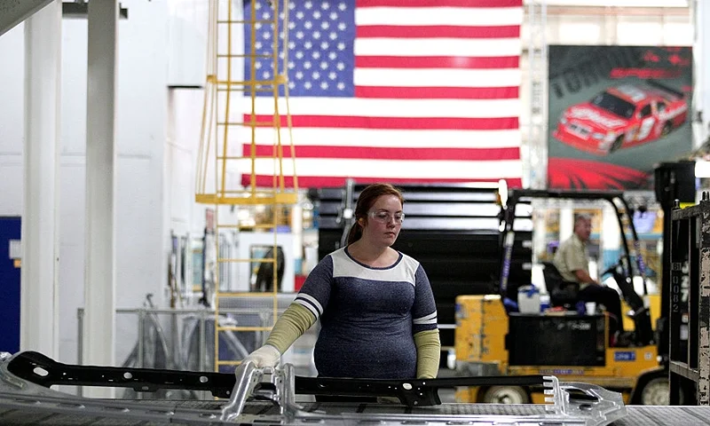 STERLING HEIGHTS, MI - AUGUST 26: A worker handle parts for Fiat Chrysler Automobiles as they come off the press at the FCA Sterling Stamping Plant August 26, 2016 in Sterling Heights, Michigan. An event was held today at the plant to celebrate the start of production of three all-new stamping presses, whose installation began in July 2015 and cost $166 million. (Photo by Bill Pugliano/Getty Images)