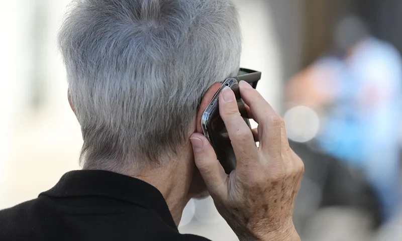 FRANCE-ECONOMY-LIFESTYLE-TELECOMS-SENIOR-CONSUMERS An elderly man uses a mobile phone while strolling on the Promenades des Anglais beachfront in the French riviera city of Nice on September 1, 2017. In a largely saturated telecommunications market, there is still a large share of the population that remains under-equipped and offers growth prospects: senior citizens. / AFP PHOTO / VALERY HACHE (Photo credit should read VALERY HACHE/AFP via Getty Images)