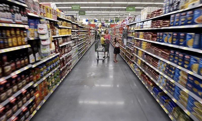 A family shops at the Wal-Mart Neighborhood Market. REUTERS/Rick Wilking