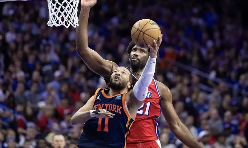 New York Knicks guard Jalen Brunson (11) drives against Philadelphia 76ers center Joel Embiid (21) during the second half of game four of the first round in the 2024 NBA playoffs at Wells Fargo Center. Mandatory Credit: Bill Streicher-USA TODAY Sports