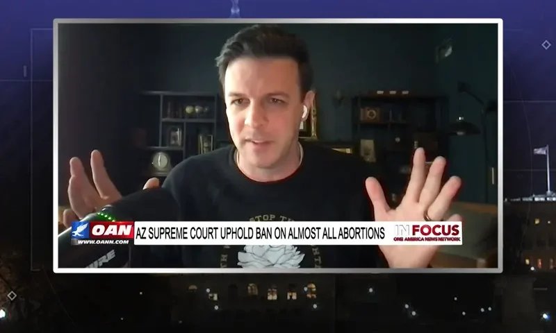 Video still from In Focus on One America News Network during an interview with the guest, Seth Gruber.